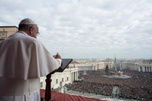 Pope Francis delivers a "Urbi et Orbi" (to the city and world) message from the balcony overlooking St. Peter's Square at the Vatican December 25, 2014. 